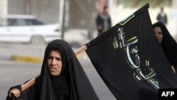 Carrying the Shi'ite banner in Iraq?