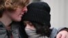 Youths react outside Russia's Supreme Court building in Moscow on November 30, 2023.