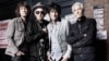 The Rolling Stones pose in front of the Marquee Club in London on July 11, 2012.