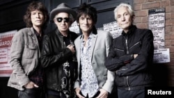 The Rolling Stones pose in front of the Marquee Club in London on July 11, 2012.