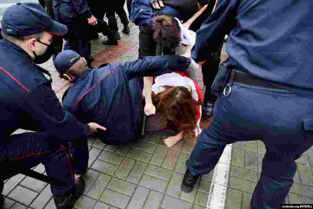 A student is detained by police.