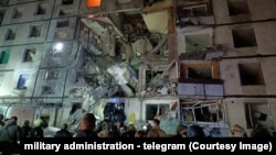 The aftermath of a Russian strike on an apartment building in Kharkiv on October 30.