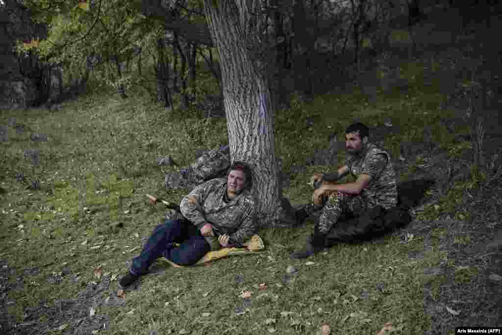 Armed volunteers relax at an undisclosed location south of Stepanakert. Armenia has a long history of armed volunteers signing up to fight in the country's wars.