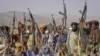 Pakistan -- Baluch rebels hold their weapons as they pose for a photograph at an undisclosed location in Baluchistan province, undated