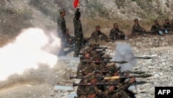 This picture taken on October 2, 2024, and released from North Korea's official Korean Central News Agency shows troops taking part in training at an undisclosed location in North Korea.
