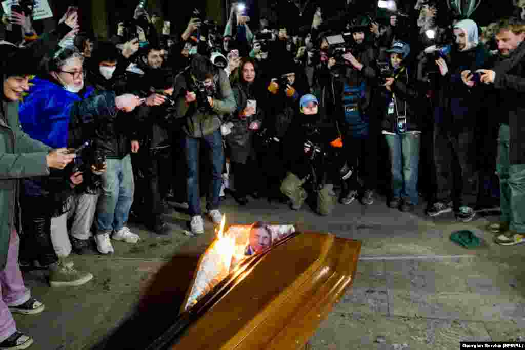 Protesters burn an effigy of Bidzina Ivanishvili on December 9. The billionaire former prime minister is the founder of the ruling Georgian Dream party. Many Georgians expressed their distaste at this symbolic form of protest. 