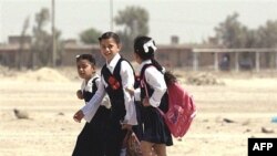 Students walk home from class in Tikrit, northwest of Baghdad. The lowest rate of primary enrollment in Iraq is among rural girls. (file photo)