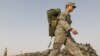 A U.S. soldier carried his bag as he prepared to leave Iraq in mid-August.
