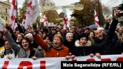 Protesters march to support former President Mikheil Saakashvili in Tbilisi on December 6.
