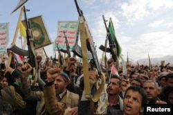 Protesters, mainly Houthi supporters, shout slogans as they rally to show support for Palestinians and Lebanon's Hezbollah in Sanaa, Yemen, on November 8.