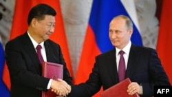 Си Цзиньпин менен Владимир Путин