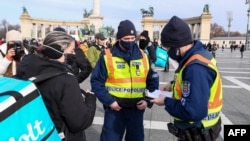 Police were seen checking the documentation of those attending the Budapest rally on January 31.