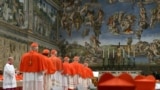 (FILES) This handout picture released by the Press office shows cardinals queuing in the Sistine Chapel to swear on the Bible to never reveal the secrets of their deliberations before the start of the conclave at the Vatican on March 12, 2013.
