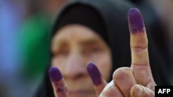 Ink-stained fingers after voting in Al-Najaf