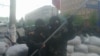 Як заявляють у СБУ, підозрюваний також перевіряв документи, речі та автомобілі людей, які перетинали міст через Сіверський Донець біля Станиці Луганської