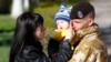A Ukrainian marine speaks with family members before departing Crimea outside a Ukrainian military base in the Crimean port city of Feodosiya on March 24.