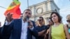 The leader of the Dignity and Truth Platform, Andrei Nastase (left), speaks to protesters in Chisinau on June 20.