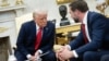 US President Donald Trump talks with US Vice President JD Vance during a meeting with El Salvador's President Nayib Bukele (not pictured) in the Oval Office of the White House in Washington, DC, April 14, 2025.