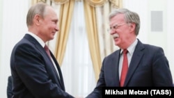 Президент Росії Володимир Путін та помічник президента США з питань національної безпеки Джон Болтон
