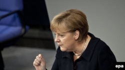 German Chancellor Angela Merkel addressing her country's parliament on December 2.