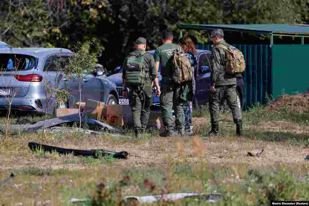 Investigators examine the site of the drone strike in Ramenskoye. As Russia continues its offensive in eastern Ukraine, Kyiv has increased its counterattacks, including cross-border strikes in Russia's western Kursk region and large-scale drone assaults deep into Russian territory.