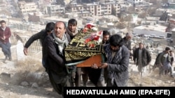 People attend the funeral of one of the victims of a suicide bomb attack in Kabul, Afghanistan, late last month.
