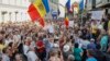 Moldovans protest in front of the headquarters of the Democratic Party after the invalidation of the mayoral election in Chisinau on June 20.