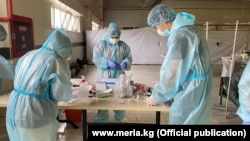 Medical workers in a temporary hospital set up in Bishkek to handle the large number of coronavirus cases