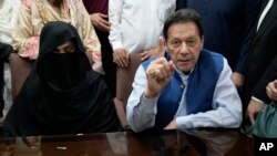 Former Pakistani Prime Minister Imran Khan and his wife, Bushra Bibi (file photo)