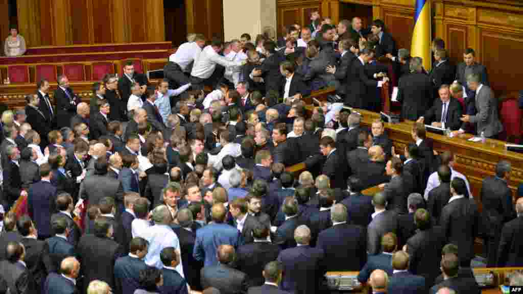 They might have been the first sessions of a new parliament, but Ukraine's lawmakers were back to their old ways on December 12 and 13 when melees on the chamber floor interrupted the proceedings.