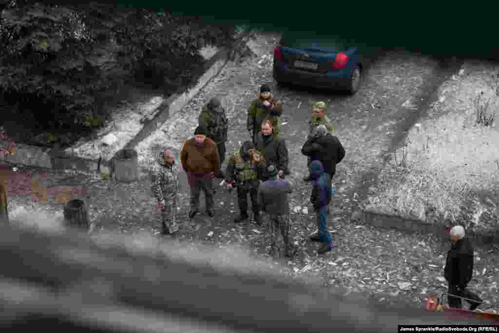 Gunmen from the self-proclaimed "Donetsk People's Republic" outside the hospital.