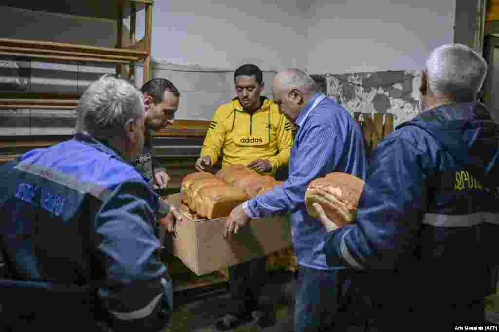 Stepanakert residents pick up bread from the bakery. 