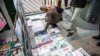 Iran -- People look at local newspapers on sale in Tehran, 25Nov2013