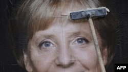 A campaign billboard in Berlin of Chancellor Angela Merkel, whose Christian Democrats looked in a position for reelection in late polling.