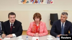 European Union foreign policy chief Catherine Ashton (center) poses with Serbia's Prime Minister Ivica Dacic (left) and Kosovo's Prime Minister Hashim Thaci in Brussels on April 19.