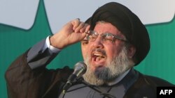 Lebanon's Hizballah chief Hassan Nasrallah makes a rare public appearance to address thousands of supporters who took to the streets of southern Beirut to denounce a film mocking Islam on September 17.