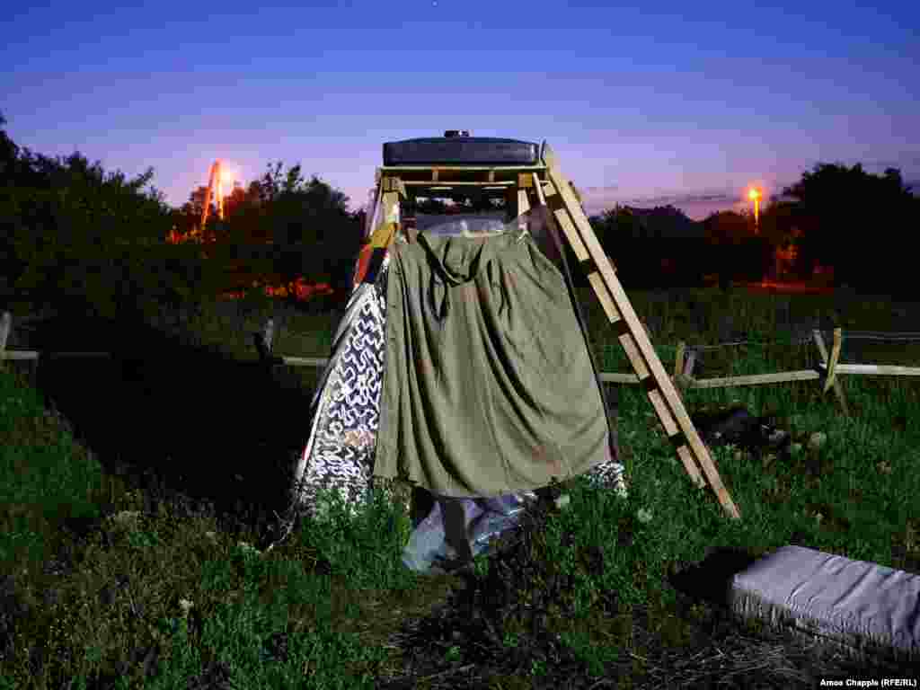 The camp's shower, supplied with water brought by a local volunteer every couple of days. The blockade resembles the scruffy, well-organized camps that sprang up around the Euromaidan protests of 2013-14, but these activists claim they have no weapons on site.