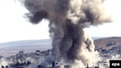 Smoke rises above the west of Kobani after a suspected U.S. air strike on October 8.