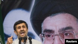 President Mahmud Ahmadinejad takes part in a demonstration to mark the 32nd anniversary of the Islamic Revolution in Tehran today.