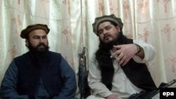 Hakimullah Mehsud (right), chief of Tehrik-e Taliban Pakistan, sits with Waliur Rehman, his deputy, during a video recording at an undisclosed location near the Pakistani-Afghan border.