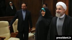 Iranian Vice President for Women's Affairs Masoumeh Ebtekar (center) recently attended a cabinet meeting and sat a few seats away from President Hassan Rohani (right).