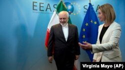 Евробиримдиктин тышкы саясат боюнча башкы комиссары Федерика Могерини жана Ирандын тышкы иштер министри Мохаммад Зариф.
