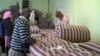 Not everyone hired at Atmiya Azimova's blanket factory could sew going in -- many had to learn their craft from the ground up.