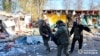 A body is removed after Russian shelling of Kupyansk on October 24.
