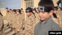 A screen capture from the nine-minute IS video titled Al Farouq Training Camp for Cubs, a term used by militants to describe young "jihadis"