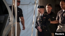 U.S. Private First Class Bradley Manning is escorted out of court after testifying in the sentencing phase of his military trial at Fort Meade, Maryland, on August 14.