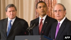 U.S. President Barack Obama (center) with Richard Holbrooke (left) and George Mitchell at the State Department on January 22