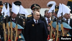 Russian President Vladimir Putin attends the 79th anniversary of the victory over Nazi Germany in World War II, in central Moscow on May 9, 2024.
