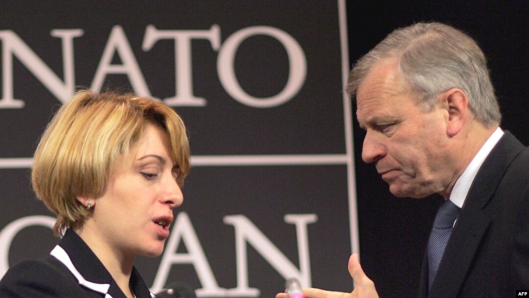 Georgian Foreign Minister Eka Tkeshelashvili (left) tried to put a positive spin on NATO chief Jaap de Hoop Scheffer's news.