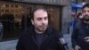 Armenia -- Andranik Gevorgian, an employee of the Yerevan metro, is interviewed by RFE/RL's Armenian service during a demonstration against pension reform, 12Feb2014.